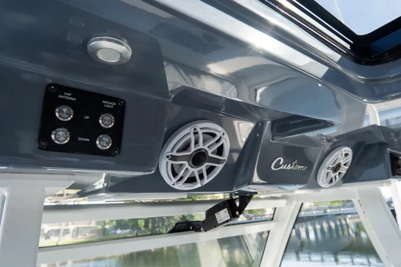 Slide: The Image of 2023 Tidewater 380 CC Adventure boat interior with speakers and control panel. - 50