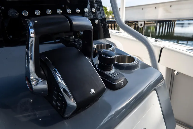 Slide: The Image of Close-up of 2023 Tidewater 380 CC Adventure boat controls and dashboard. - 54