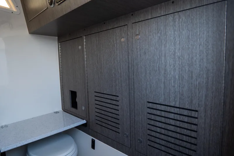 Slide: The Image of 2023 Tidewater 380 CC Adventure interior with sleek cabinetry and modern design. - 61
