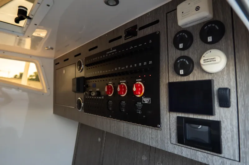 Slide: The Image of Control panel of 2023 Tidewater 380 CC Adventure boat, featuring gauges and diagnostic tools. - 62