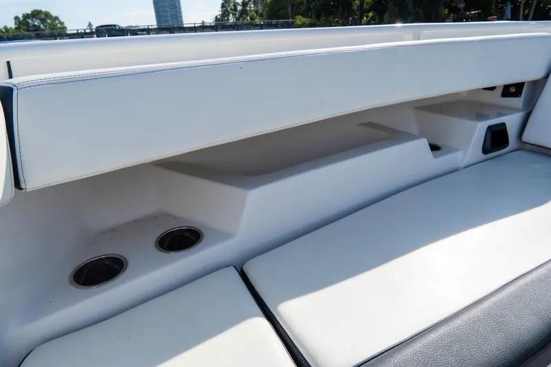 Slide: The Image of 2023 Tidewater 380 CC Adventure boat interior seating with cup holders. - 68