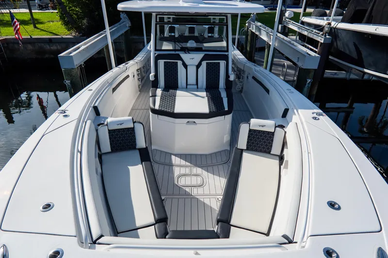 Slide: The Image of 2023 Tidewater 380 CC Adventure boat interior with luxurious seating and sleek design. - 69