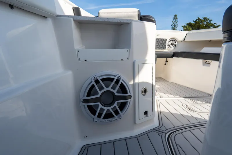 Slide: The Image of 2023 Tidewater 380 CC Adventure boat interior with speaker and seating area. - 72