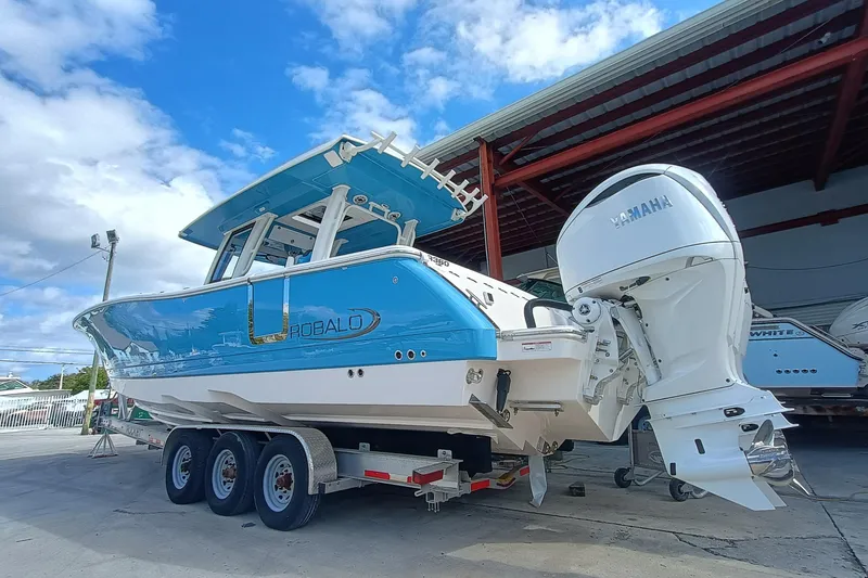 Slide: The Image of 2026 Robalo R360 Center Console boat with Yamaha engine on trailer. - 3