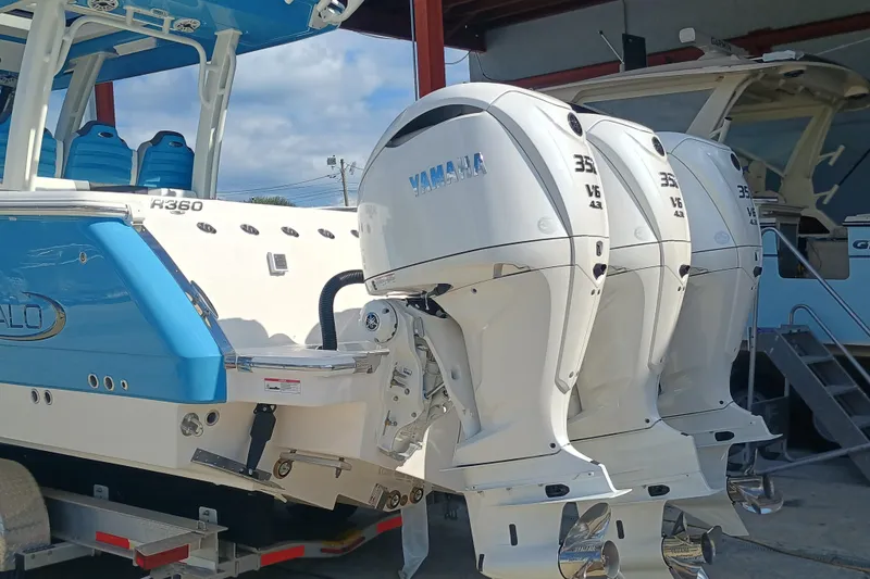 Slide: The Image of 2026 Robalo R360 Center Console with triple Yamaha outboard engines. - 5