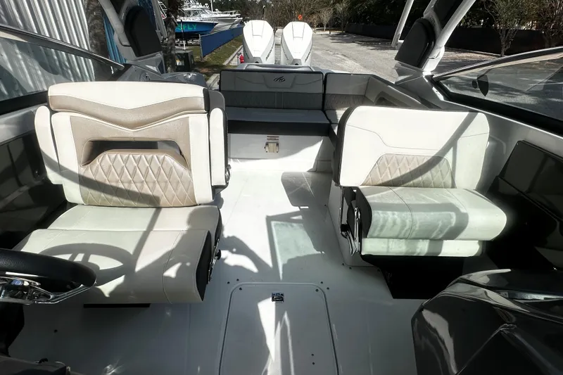 Slide: The Image of 2023 Monterey 305SS Super Sport boat interior with luxurious seating and modern design. - 12