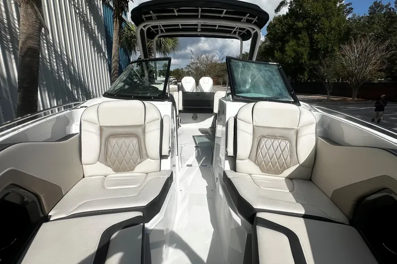 Slide: The Image of 2023 Monterey 305SS Super Sport boat interior with luxurious seating and modern design. - 13