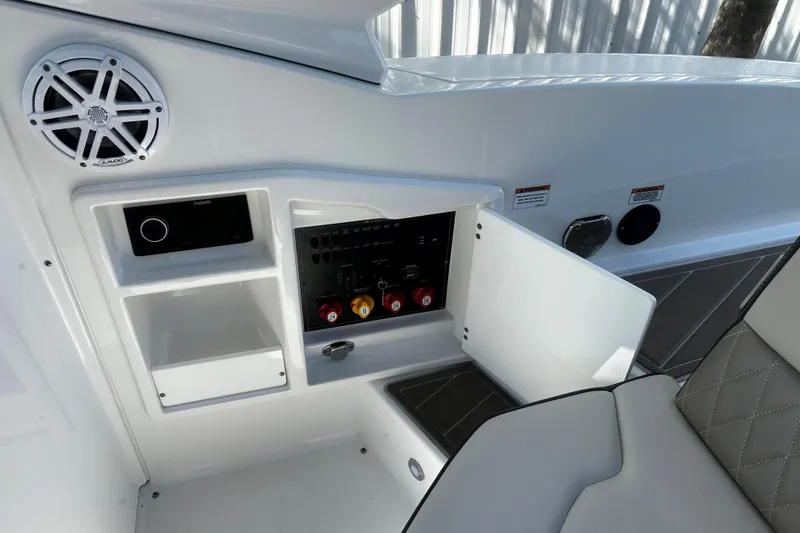 Slide: The Image of 2023 Monterey 305SS Super Sport boat interior with speaker and control panel. - 4