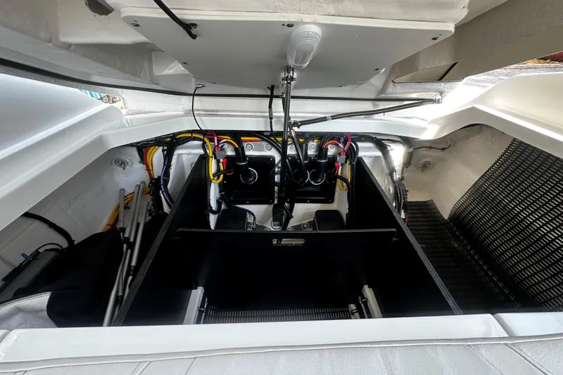 Slide: The Image of Engine compartment of 2023 Monterey 305SS Super Sport boat, showcasing wiring and components. - 7