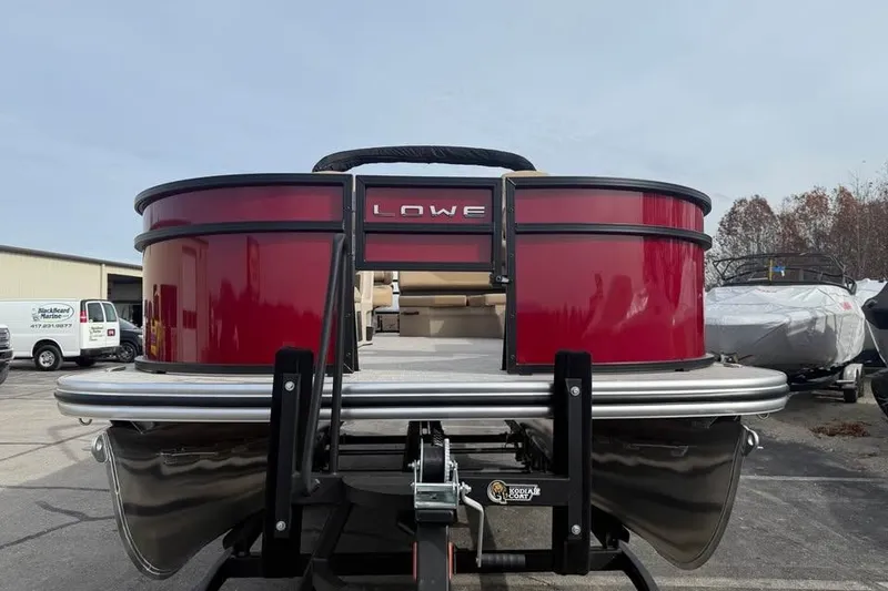 Slide: The Image of 2026 Lowe LF 214 pontoon boat with red exterior on a trailer. - 2