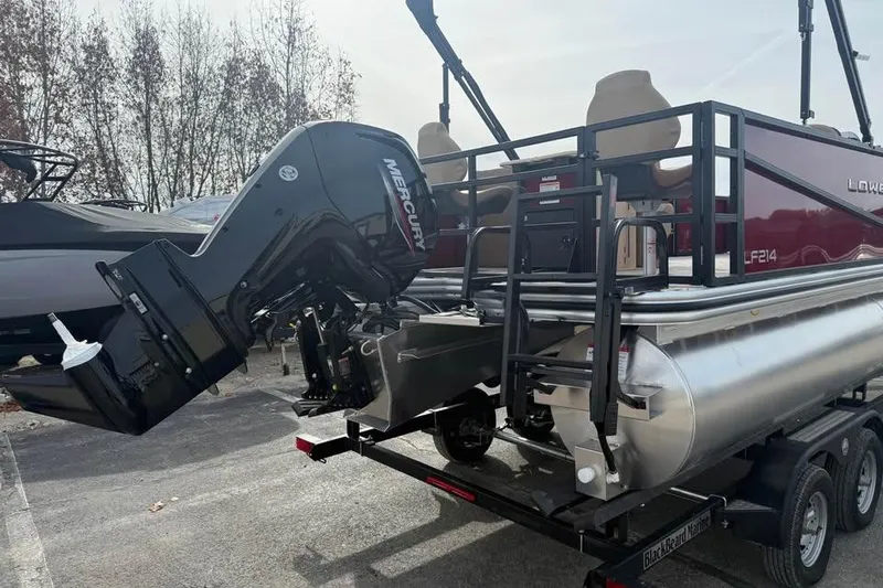 Slide: The Image of 2026 Lowe LF 214 pontoon boat with Mercury outboard motor on trailer. - 5