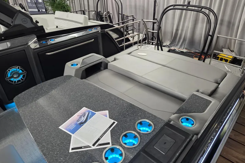 Slide: The Image of 2026 Godfrey SA boat interior with modern seating and illuminated cup holders. - 4