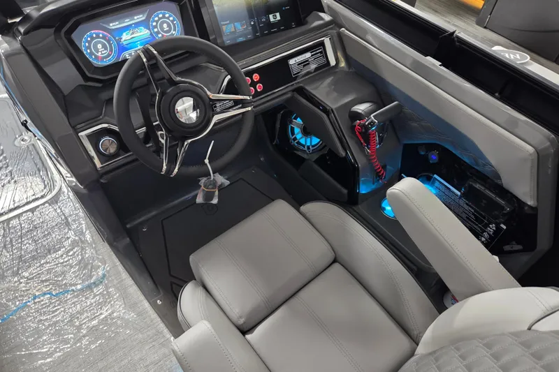 Slide: The Image of 2026 Godfrey SA boat interior with modern dashboard and illuminated controls. - 8