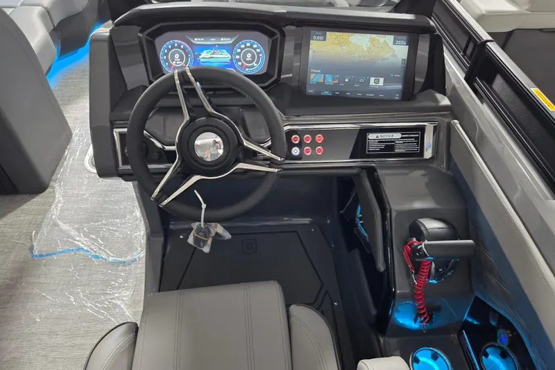 Slide: The Image of 2026 Godfrey SA boat dashboard with modern steering wheel and digital displays. - 9