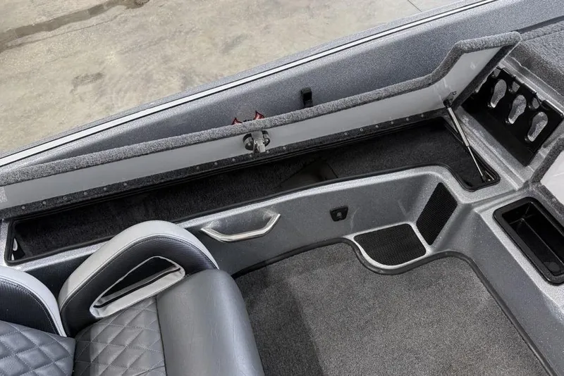 Slide: The Image of Interior of 2025 Phoenix 920 Elite II boat, featuring seating and storage compartments. - 11