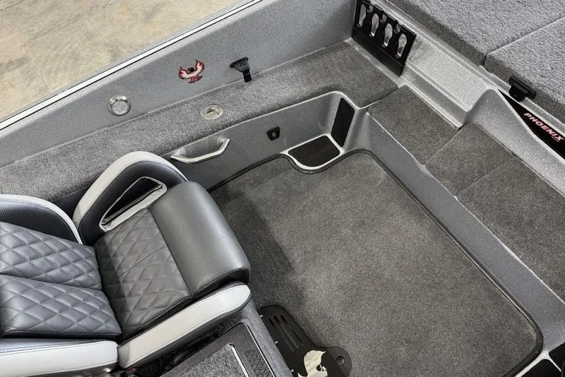 Slide: The Image of Interior of 2025 Phoenix 920 Elite II boat with gray seating and carpeted flooring. - 15