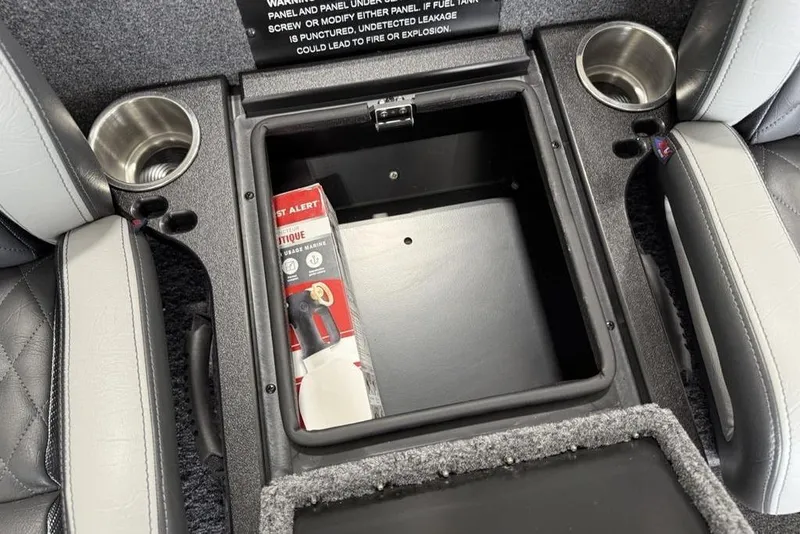 Slide: The Image of Interior of 2025 Phoenix 920 Elite II with storage compartment and cup holders. - 16