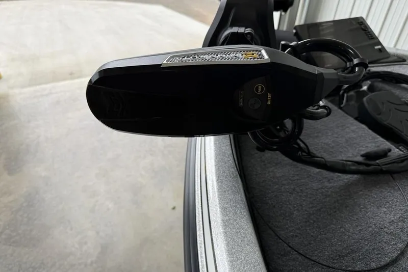 Slide: The Image of Close-up of a 2025 Phoenix 920 Elite II boat component, featuring sleek design and controls. - 8