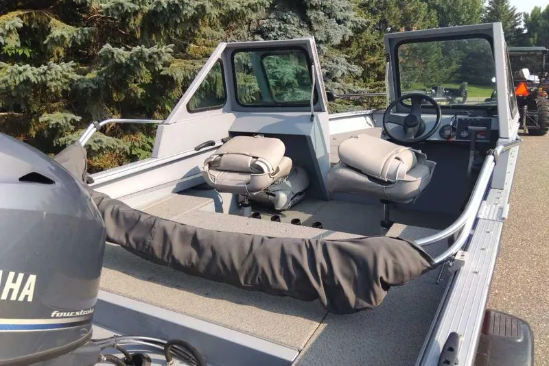 Slide: The Image of 2015 G3 Guide V177 WT boat with Yamaha motor, parked outdoors. - 12