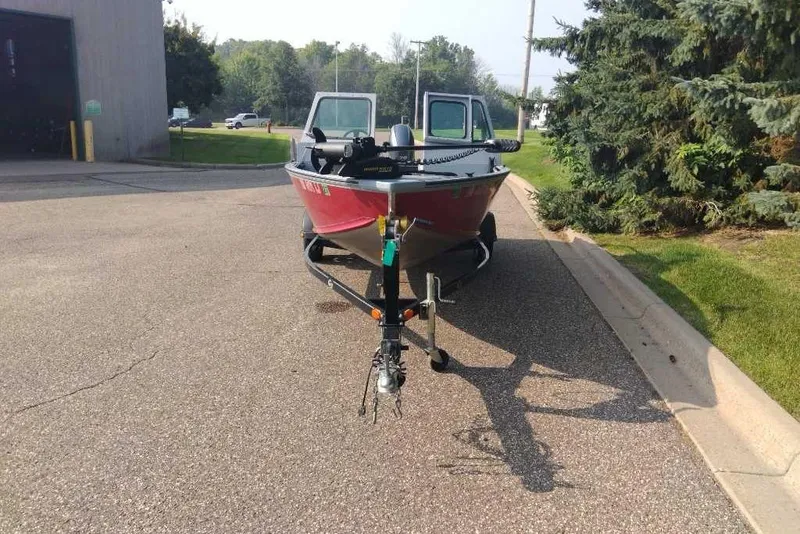 Slide: The Image of 2015 G3 Guide V177 WT boat on trailer, parked outdoors. - 13