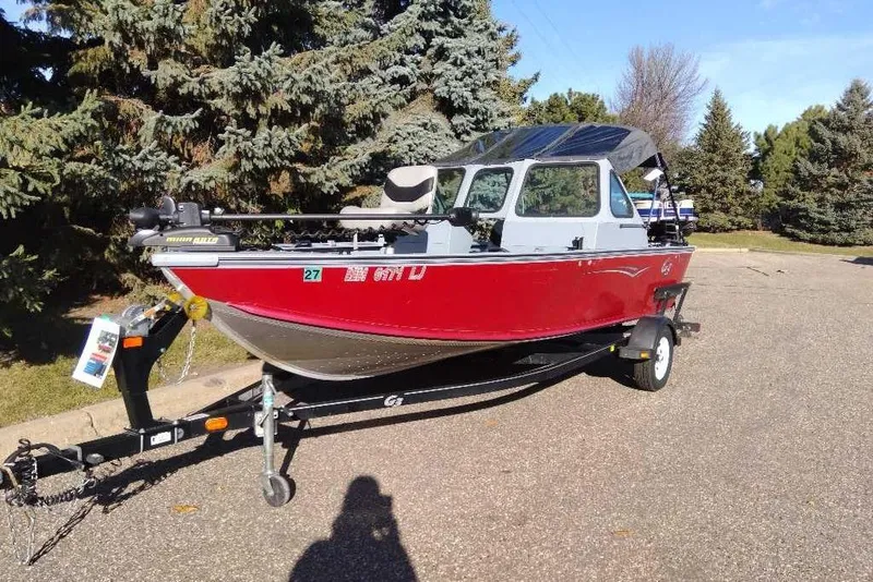 Slide: The Image of 2015 G3 Guide V177 WT boat on trailer, parked outdoors. - 3