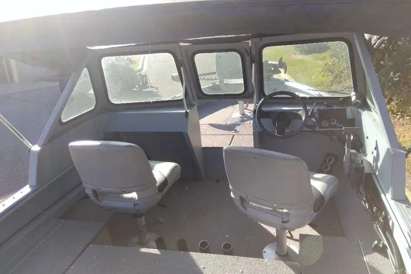 Slide: The Image of Interior of 2015 G3 Guide V177 WT boat with two seats and steering console. - 5