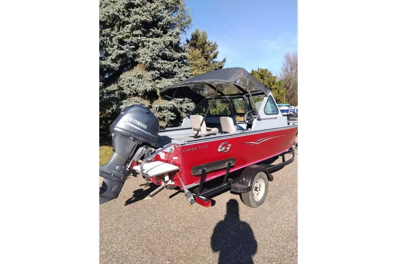 Slide: The Image of 2015 G3 Guide V177 WT boat with Yamaha motor on trailer, parked outdoors. - 8