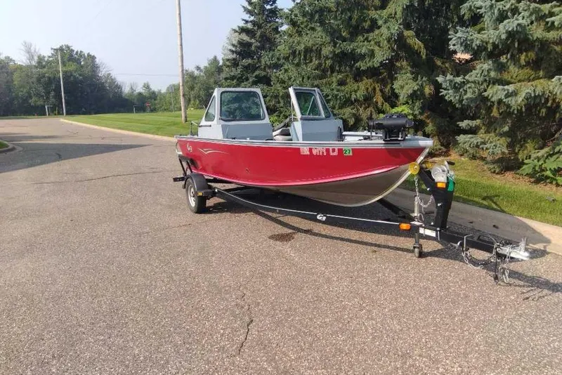 Slide: The Image of 2015 G3 Guide V177 WT boat on trailer, parked on a suburban street. - 9