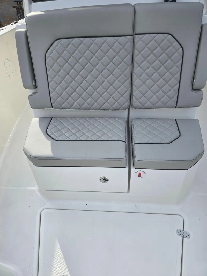 Slide: The Image of 2025 Pursuit S 288 boat seat with gray quilted upholstery. - 16
