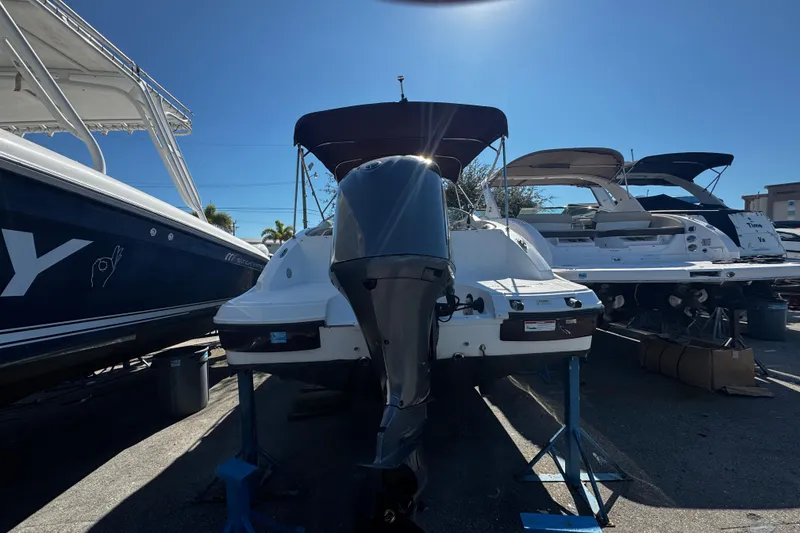The Image of 2019 Hurricane SunDeck 2690 OB boat on display with outboard motor. - 0