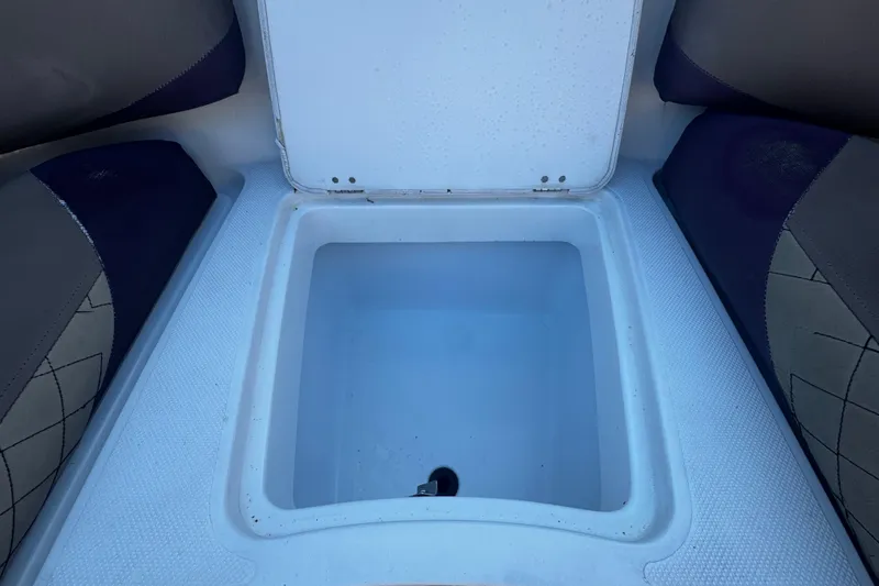 Slide: The Image of 2019 Hurricane SunDeck 2690 OB boat storage compartment, open and empty. - 16