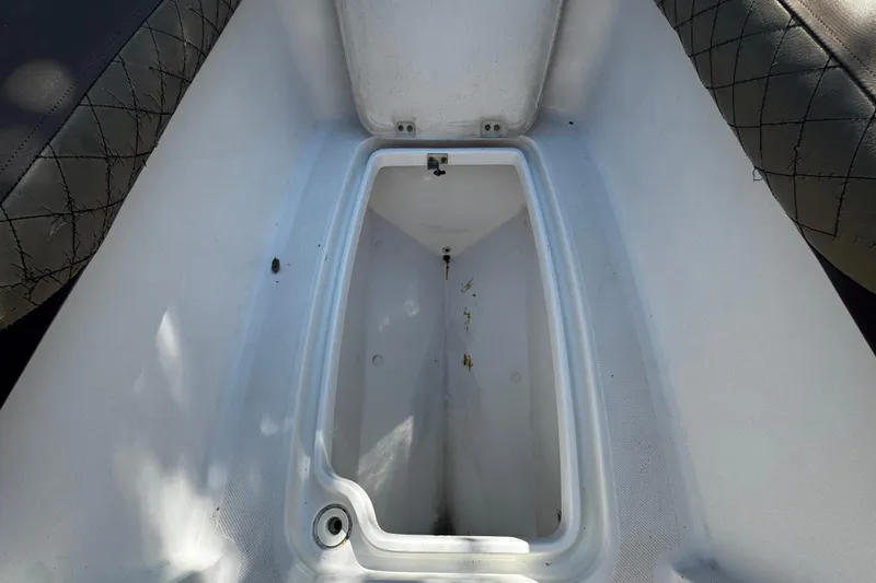 Slide: The Image of Storage compartment of 2019 Hurricane SunDeck 2690 OB boat, featuring spacious interior. - 17