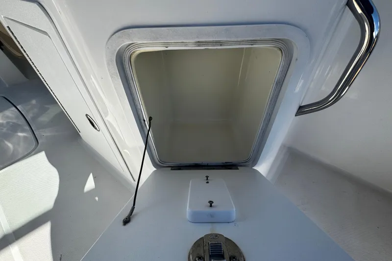 Slide: The Image of Open storage compartment on 2019 Hurricane SunDeck 2690 OB boat. - 19
