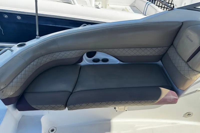 Slide: The Image of 2019 Hurricane SunDeck 2690 OB boat seating with quilted upholstery and cup holders. - 21