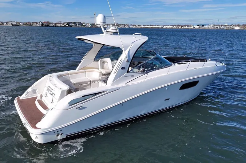 The Image of 2010 Sea Ray 370 Sundancer yacht cruising on open water. - 0