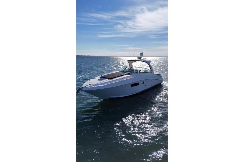 Slide: The Image of 2010 Sea Ray 370 Sundancer yacht cruising on a sunny day. - 11