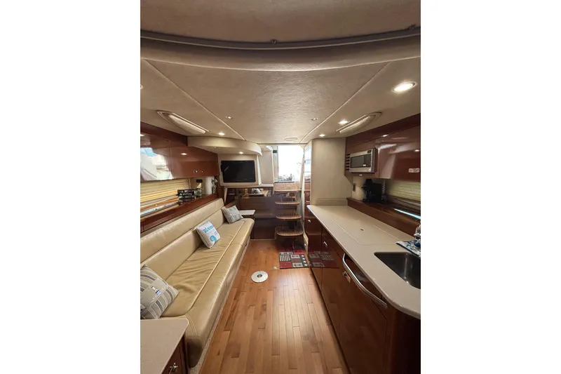 Slide: The Image of Luxurious interior of 2010 Sea Ray 370 Sundancer yacht with modern amenities and elegant design. - 28