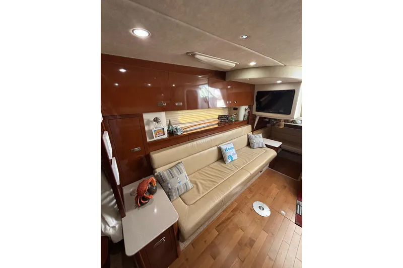 Slide: The Image of Luxurious interior of 2010 Sea Ray 370 Sundancer yacht with leather seating and modern amenities. - 32