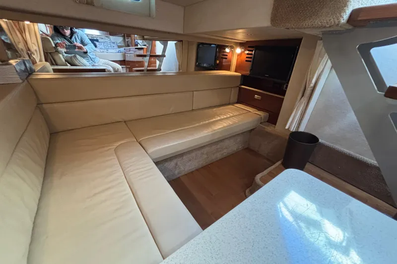Slide: The Image of Interior of 2010 Sea Ray 370 Sundancer with beige seating and modern amenities. - 39