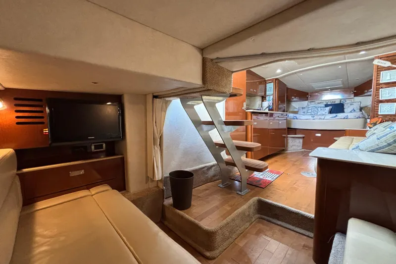 Slide: The Image of Interior of 2010 Sea Ray 370 Sundancer yacht with cozy seating and modern amenities. - 40