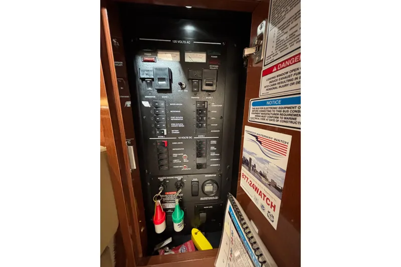Slide: The Image of Electrical control panel inside a 2010 Sea Ray 370 Sundancer boat. - 41