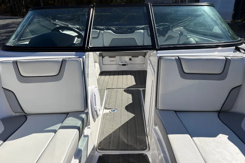 Slide: The Image of 2018 Yamaha SX190 boat interior with white seating and windshield. - 10