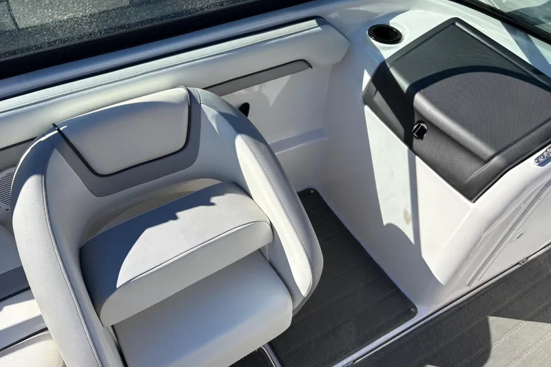 Slide: The Image of 2018 Yamaha SX190 boat interior with gray seating and storage compartment. - 12