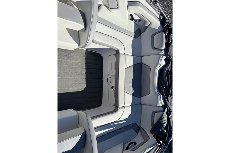 Slide: The Image of 2018 Yamaha SX190 boat interior with gray seating and carpeted flooring. - 14