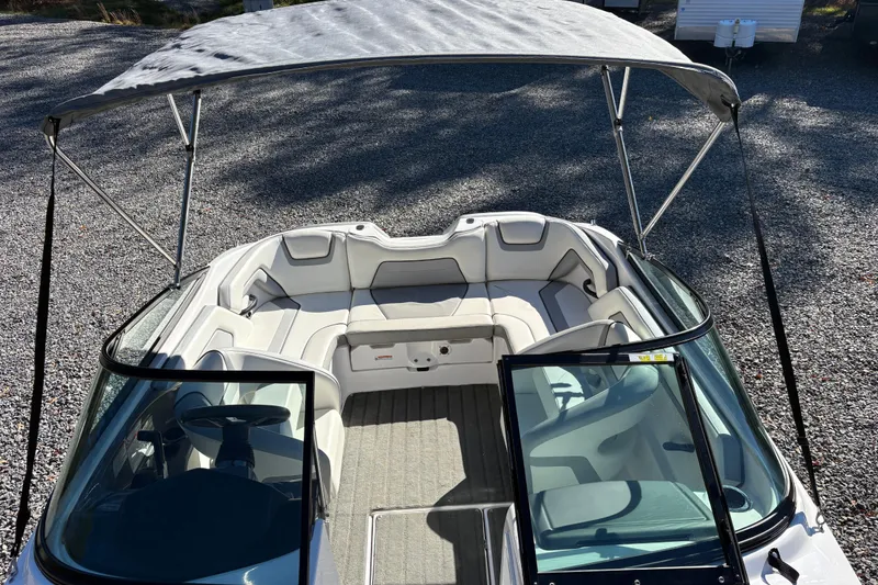 Slide: The Image of 2018 Yamaha SX190 boat interior with canopy, featuring spacious seating and modern design. - 15