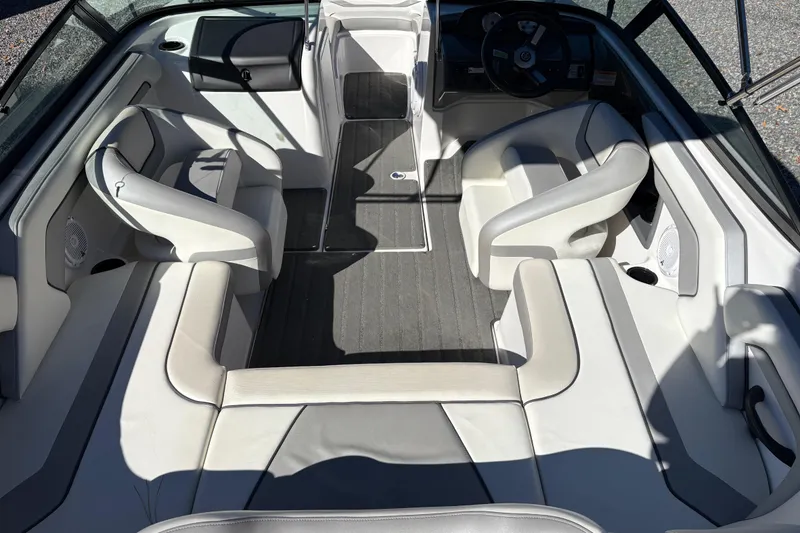 Slide: The Image of 2018 Yamaha SX190 boat interior with sleek seating and modern dashboard design. - 6