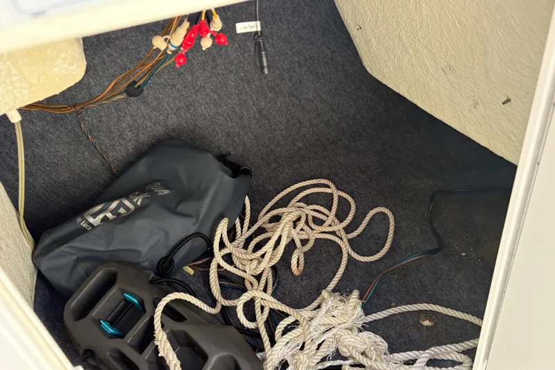 Slide: The Image of Storage compartment of a 2018 Yamaha SX190 boat with ropes and equipment. - 7