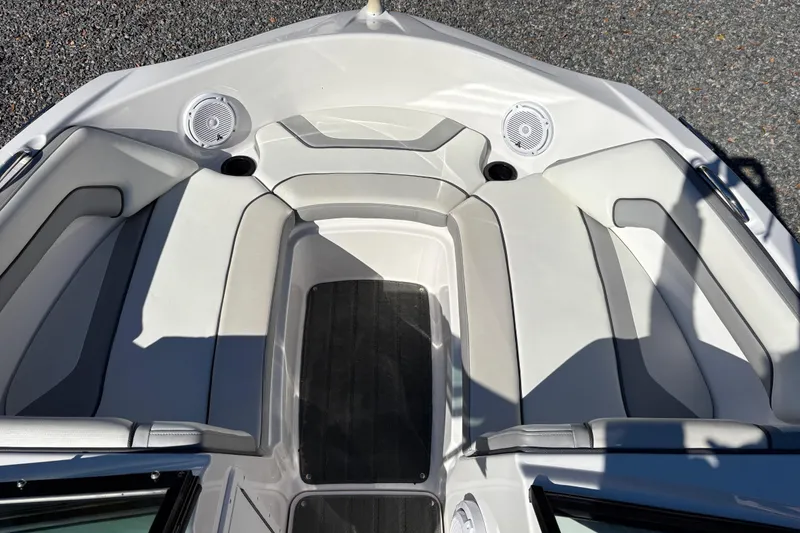 Slide: The Image of 2018 Yamaha SX190 boat interior with cushioned seating and built-in speakers. - 9