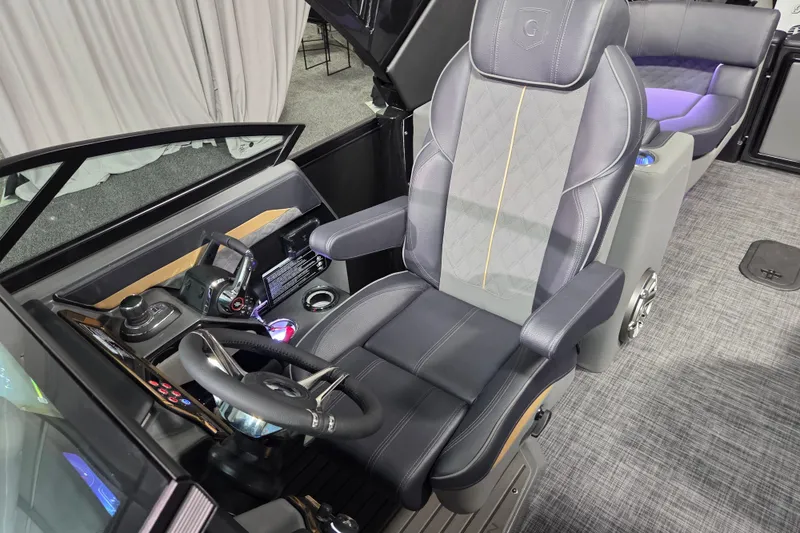 Slide: The Image of Captain's seat and helm of 2026 Godfrey Sanpan 2700 SBW Twin boat, featuring modern controls. - 22