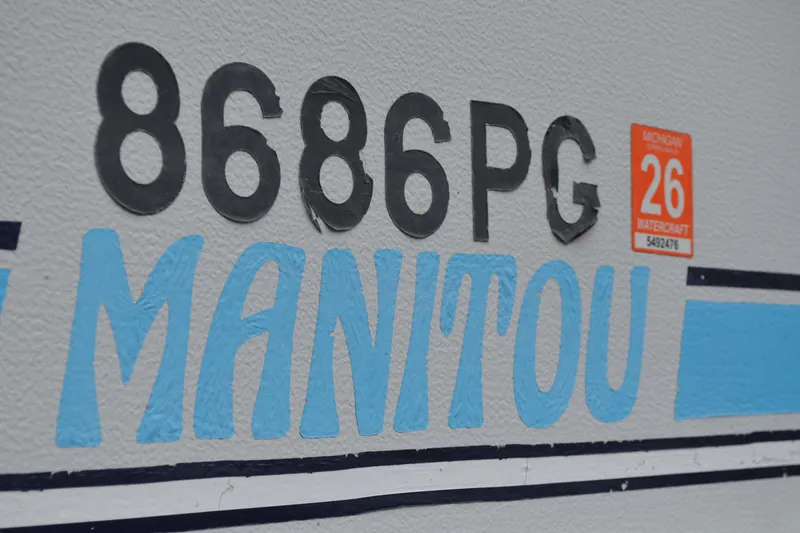 Slide: The Image of 1992 Manitou SPORT watercraft registration, Michigan sticker, and identification number 8686PG. - 20